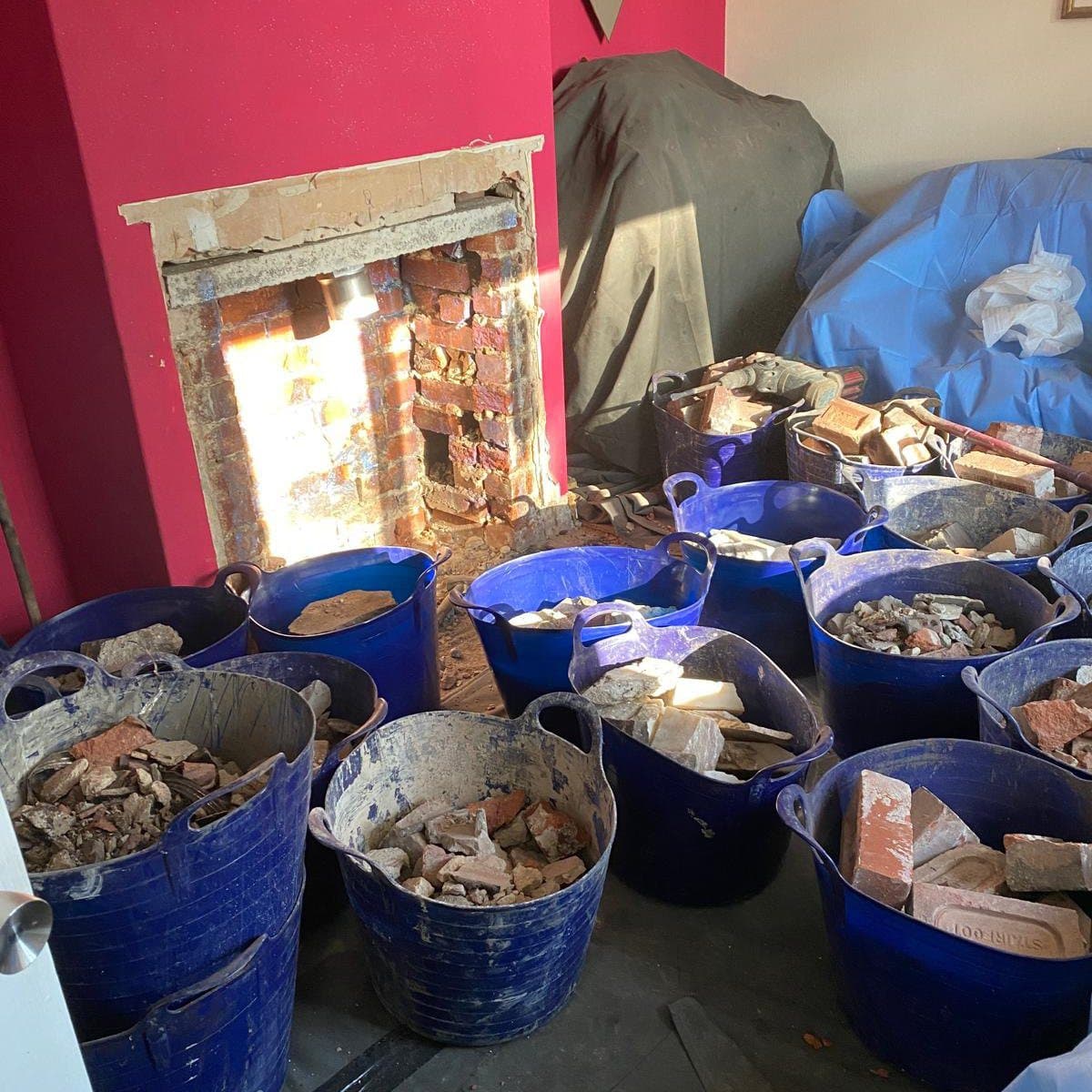 Fireplace chamber strip out with rubble bagged ready for removal